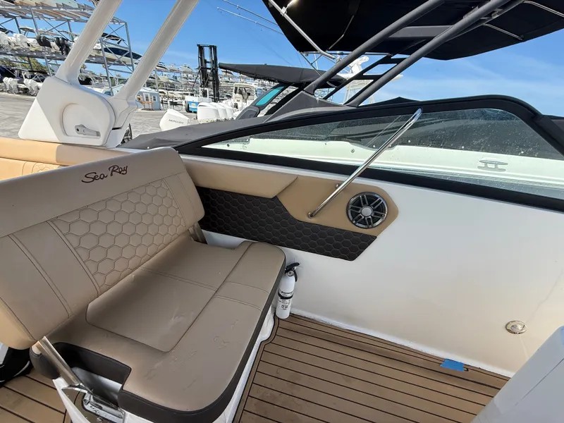 Slide: The Image of Interior of 2023 Sea Ray SDX 250 Outboard with beige seating. - 17