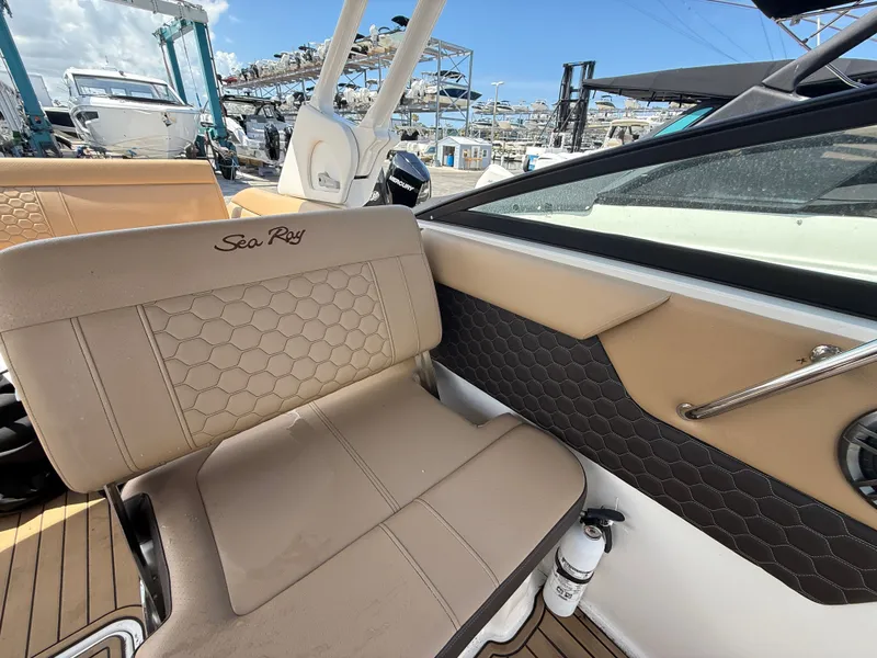 Slide: The Image of 2023 Sea Ray SDX 250 Outboard boat by the water with luxurious interior. - 18