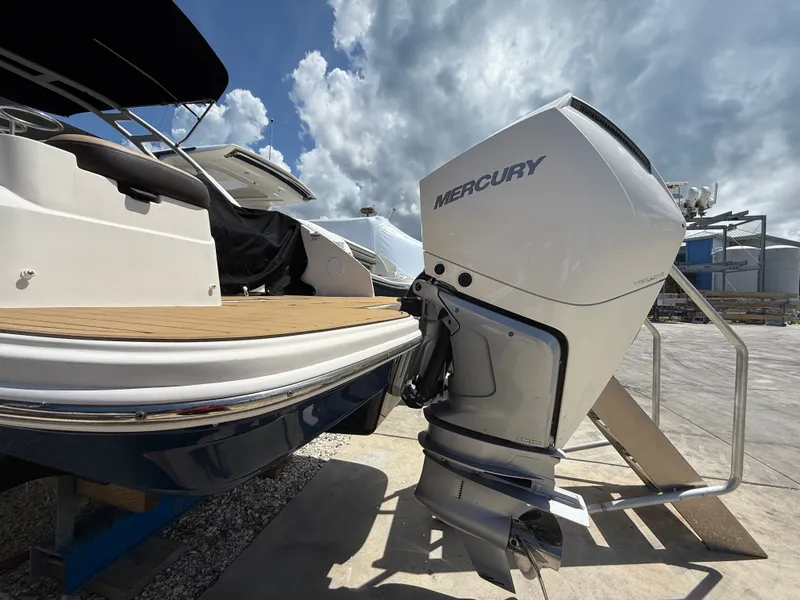 Slide: The Image of 2023 Sea Ray SDX 250 Outboard with Mercury engine, side view. - 6