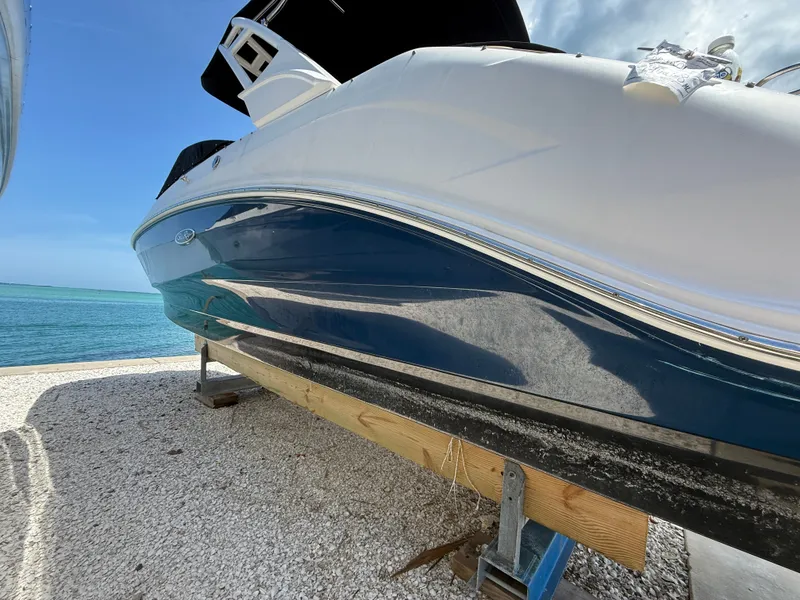 Slide: The Image of Interior of 2023 Sea Ray SDX 250 Outboard with helm console. - 9