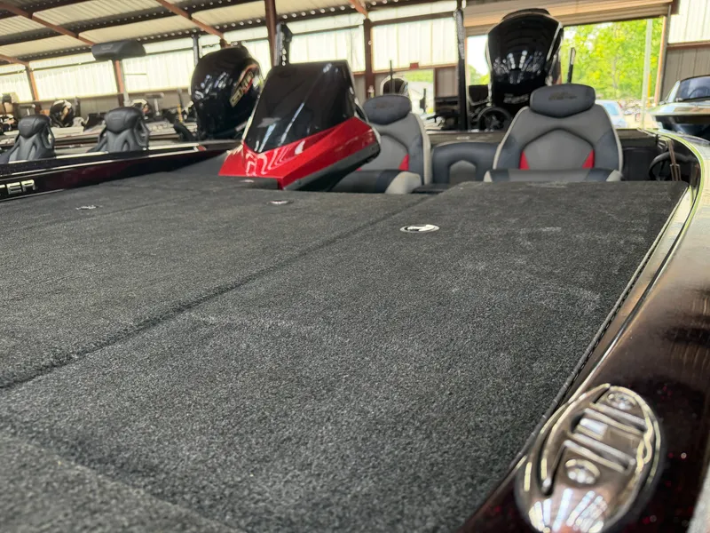 Slide: The Image of 2017 Skeeter ZX225 boat with gray carpet and red accents. - 10