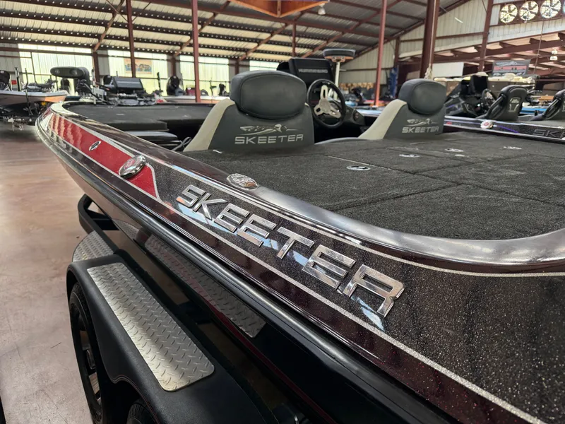 Slide: The Image of 2017 Skeeter ZX225 boat in a warehouse setting. - 2