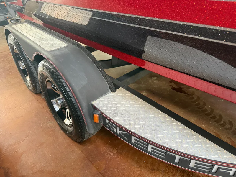 Slide: The Image of 2017 Skeeter ZX225 boat trailer with diamond-patterned step board. - 23