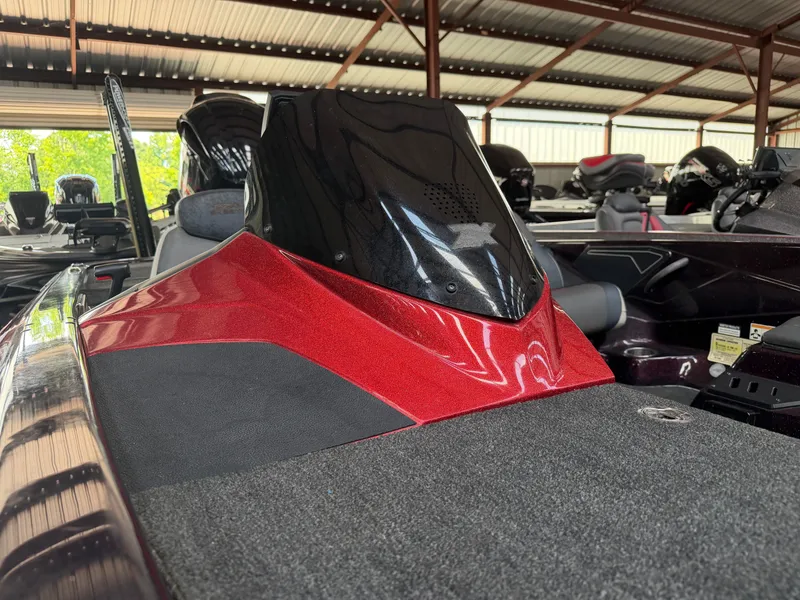 Slide: The Image of 2017 Skeeter ZX225 boat in red color under a covered area. - 4