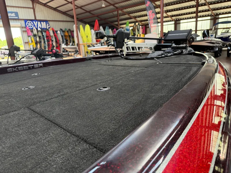 Slide: The Image of 2017 Skeeter ZX225 boat in a warehouse with equipment. - 5