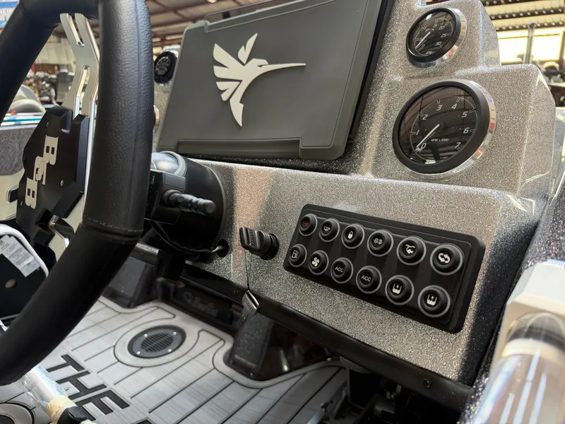 Slide: The Image of Dashboard of 2026 Bass Cat Cougar FTD SP with controls and gauges. - 13