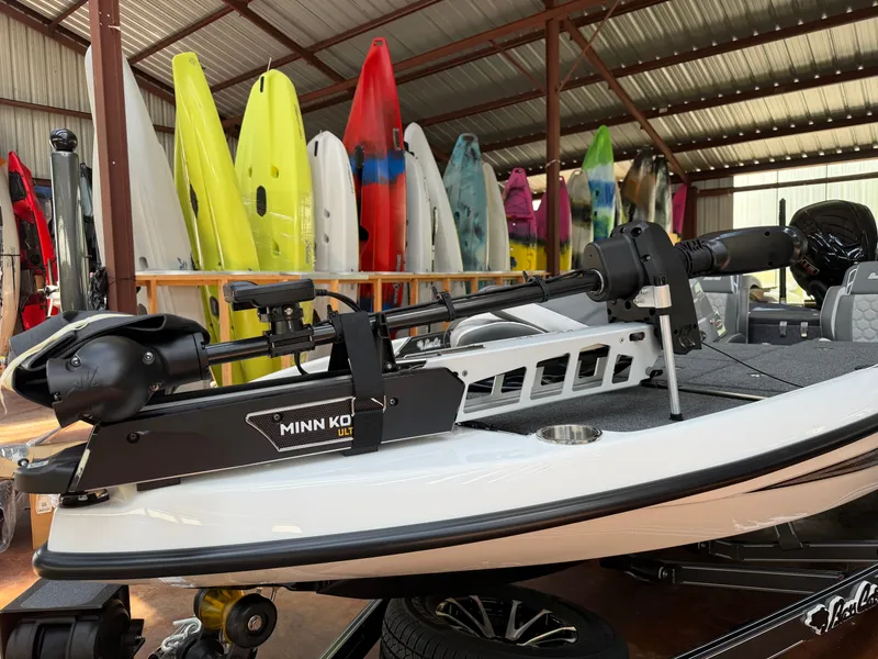 Slide: The Image of 2026 Bass Cat Cougar FTD SP with Minn Kota motor in warehouse. - 7