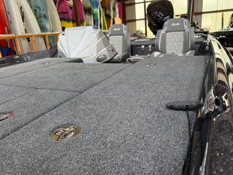 Slide: The Image of 2026 Bass Cat Cougar FTD SP boat interior with gray carpet. - 9