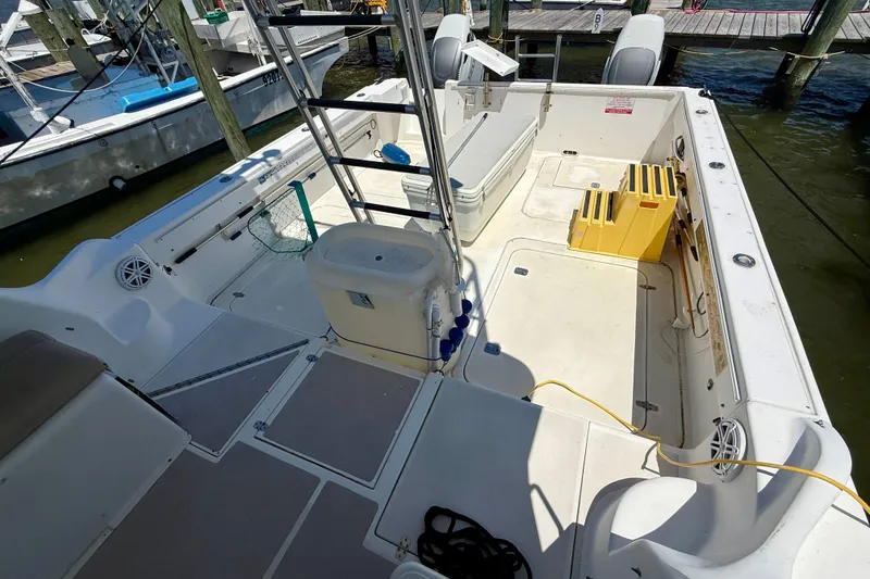 Slide: The Image of 2000 BAJA CRUISER King Cat 340 boat interior with fishing gear and docked at marina. - 15