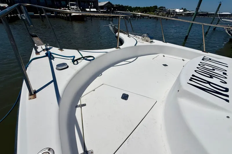 Slide: The Image of Bow view of 2000 BAJA CRUISER King Cat 340 docked at marina. - 22