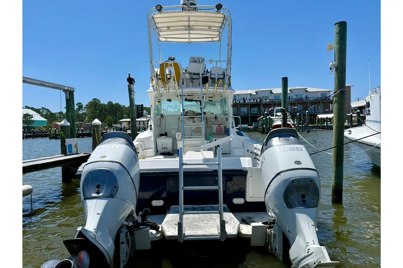 Slide: The Image of 2000 BAJA CRUISER King Cat 340 docked with twin outboard engines. - 3
