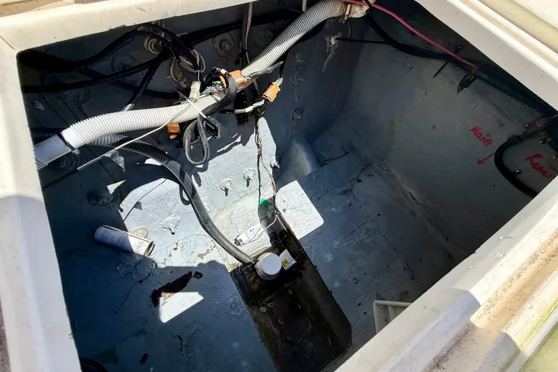 Slide: The Image of Open engine compartment of a 2000 BAJA CRUISER King Cat 340 boat. - 31