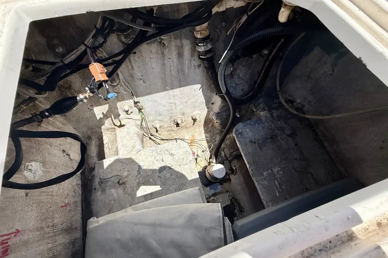 Slide: The Image of Engine compartment of a 2000 BAJA CRUISER King Cat 340, showing wiring and components. - 32
