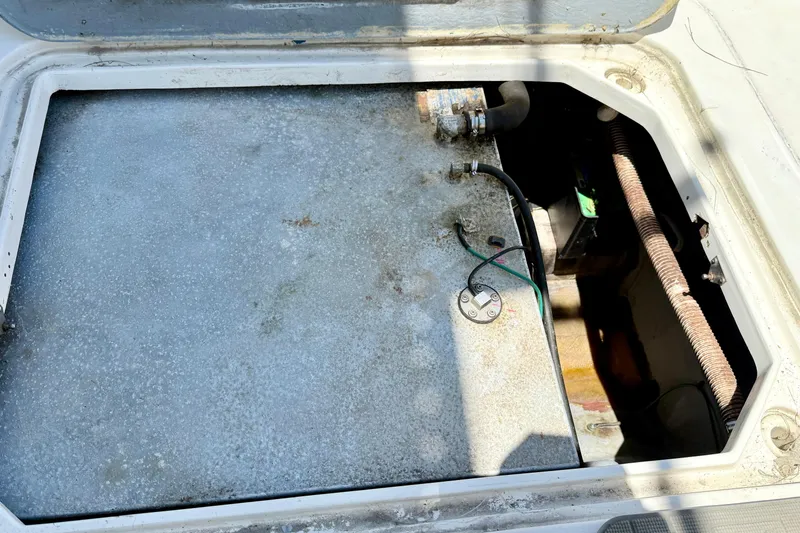 Slide: The Image of Open engine compartment of a 2000 BAJA CRUISER King Cat 340 boat. - 34