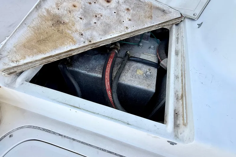 Slide: The Image of Open engine compartment of a 2000 BAJA CRUISER King Cat 340 boat. - 36