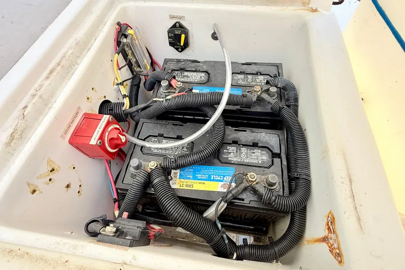 Slide: The Image of Battery compartment of a 2000 BAJA CRUISER King Cat 340 with wiring and connections. - 38
