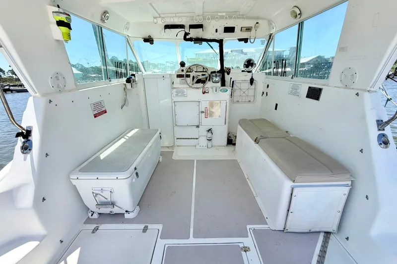 Slide: The Image of Interior of a 2000 BAJA CRUISER King Cat 340 boat with seating and steering controls. - 41