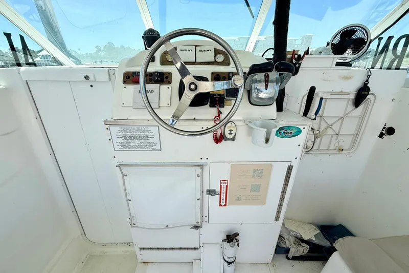 Slide: The Image of Cockpit of 2000 BAJA CRUISER King Cat 340 with steering wheel and controls. - 42