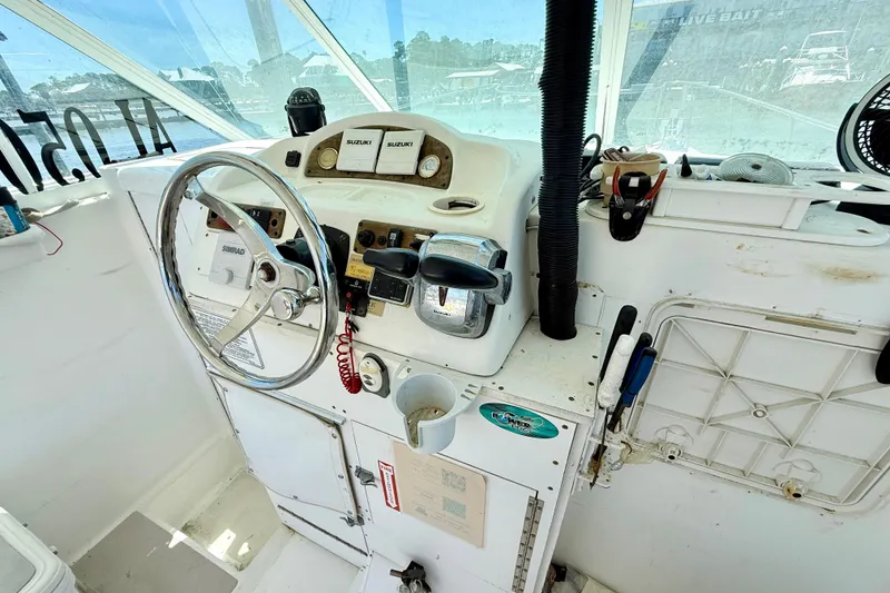 Slide: The Image of Cockpit of 2000 BAJA CRUISER King Cat 340 with steering wheel and controls. - 43