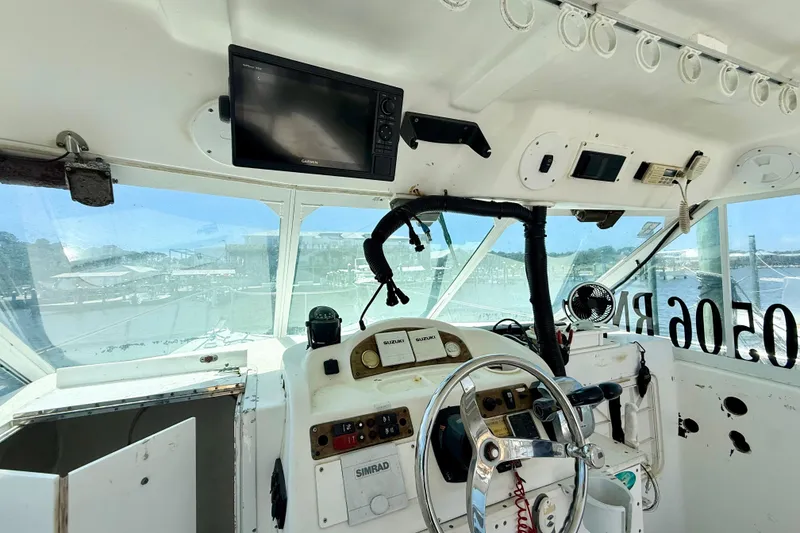 Slide: The Image of Cockpit of 2000 BAJA CRUISER King Cat 340 with navigation equipment and steering wheel. - 46