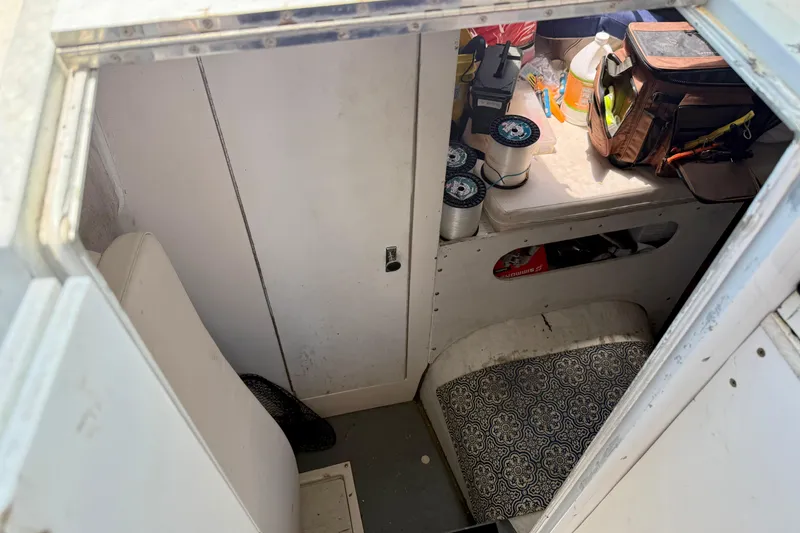 Slide: The Image of Interior of 2000 BAJA CRUISER King Cat 340 with fishing gear and supplies. - 49