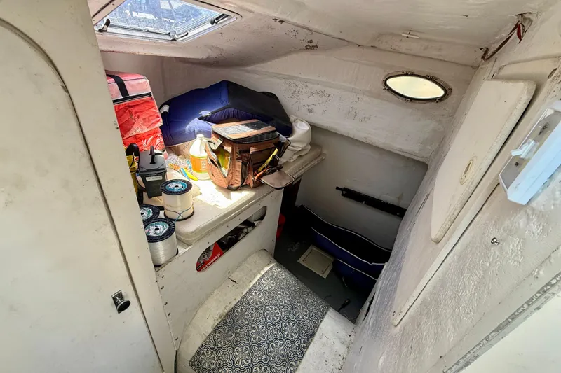 Slide: The Image of Interior of 2000 BAJA CRUISER King Cat 340 boat with fishing gear and supplies. - 50