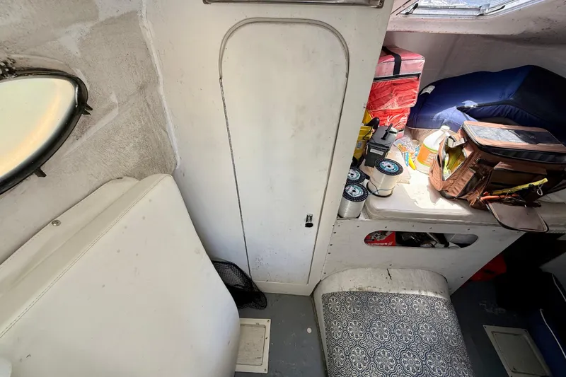 Slide: The Image of Interior of 2000 BAJA CRUISER King Cat 340 with storage and seating area. - 51