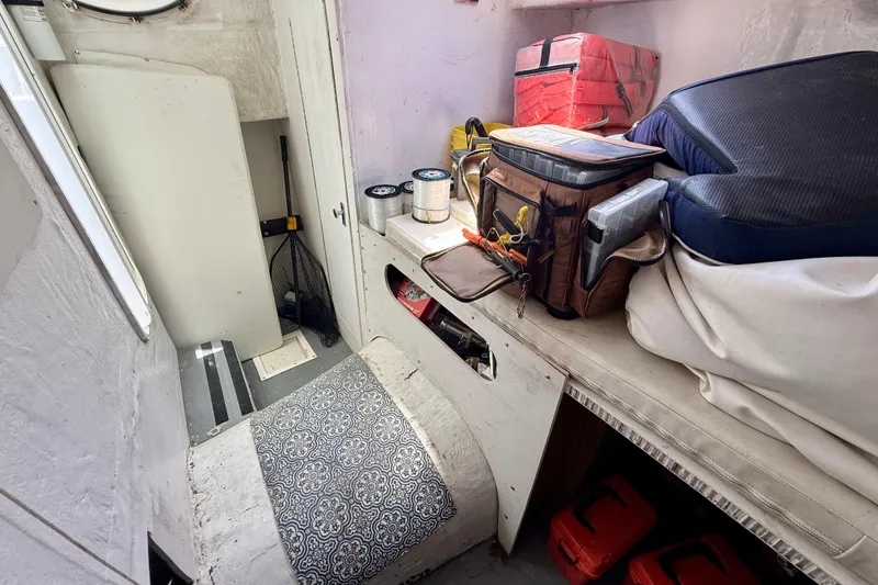 Slide: The Image of Interior of 2000 BAJA CRUISER King Cat 340 with storage and equipment. - 55