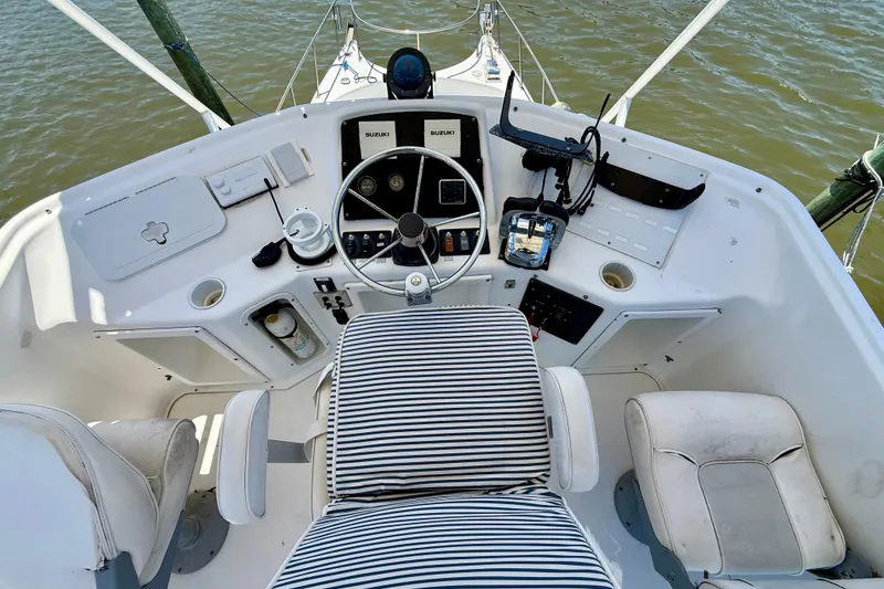 Slide: The Image of Cockpit of 2000 BAJA CRUISER King Cat 340 with striped seating and control panel. - 60