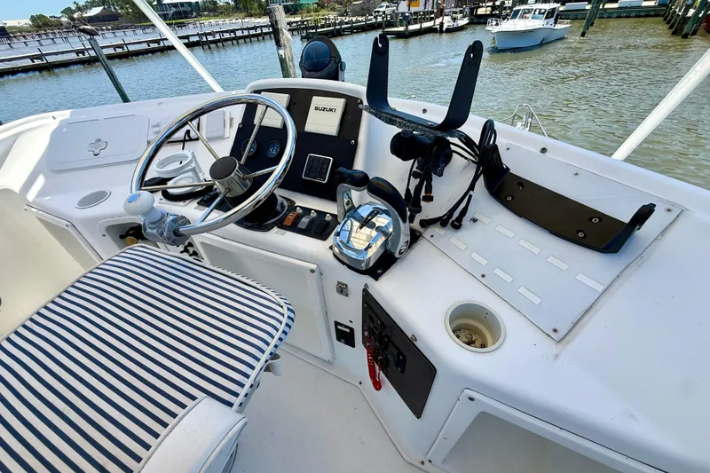 Slide: The Image of Cockpit of 2000 BAJA CRUISER King Cat 340 with striped seating and steering wheel. - 61