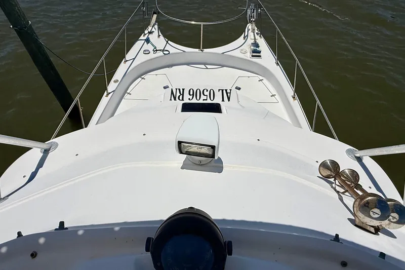 Slide: The Image of 2000 BAJA CRUISER King Cat 340 boat deck with railing and spotlight. - 62