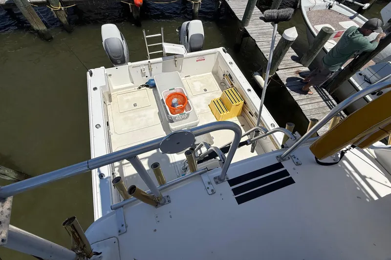 Slide: The Image of Boat deck of 2000 BAJA CRUISER King Cat 340 with equipment and dock view. - 63
