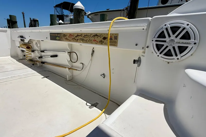 Slide: The Image of Interior of 2000 BAJA CRUISER King Cat 340 with fishing gear and JL Audio speaker. - 67
