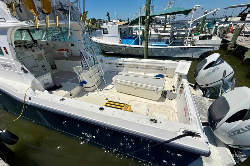 Slide: The Image of 2000 BAJA CRUISER King Cat 340 docked with Suzuki outboard motors. - 8