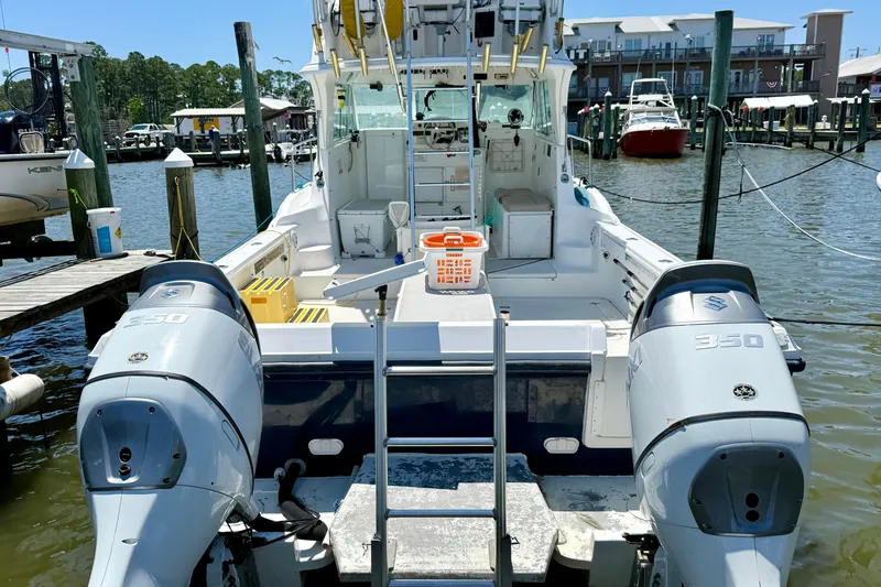Slide: The Image of 2000 BAJA CRUISER King Cat 340 docked with twin Suzuki 350 engines. - 9
