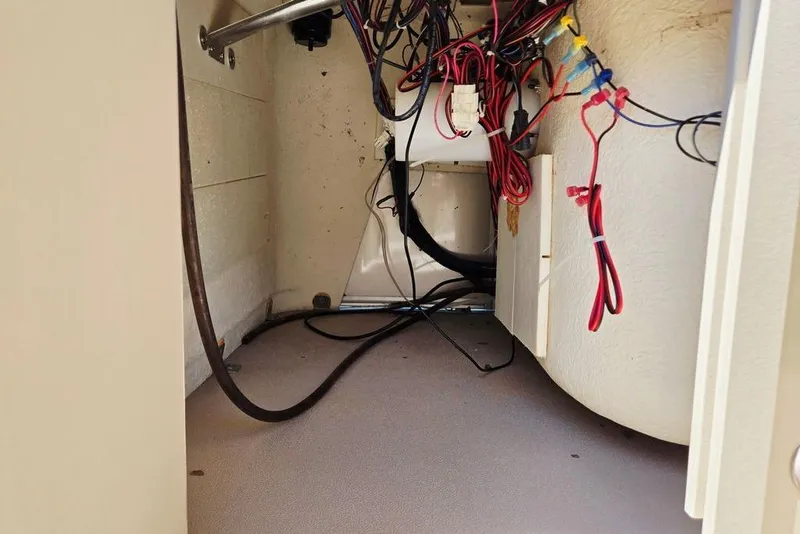 Slide: The Image of Interior wiring of a 2019 Starcraft EX 20 C boat, showing cables and connections. - 16