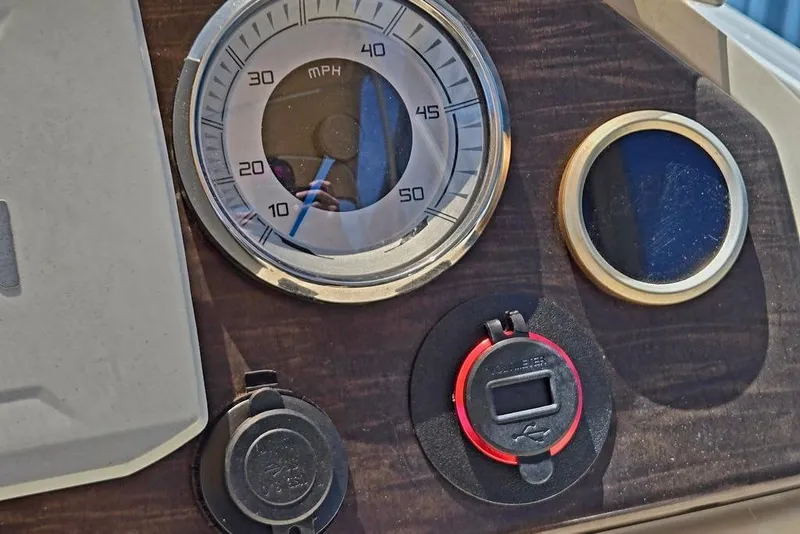 Slide: The Image of Dashboard of a 2019 Starcraft EX 20 C boat with speedometer and controls. - 19