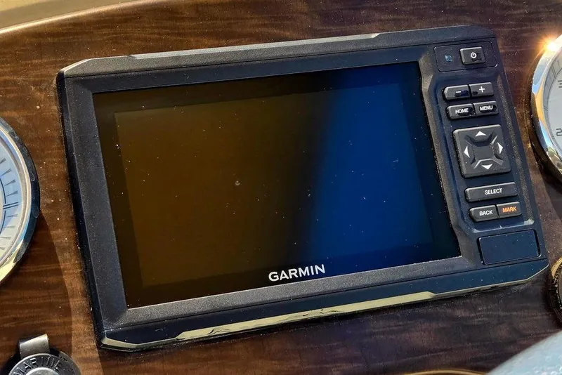 Slide: The Image of Garmin navigation system on 2019 Starcraft EX 20 C boat dashboard. - 24