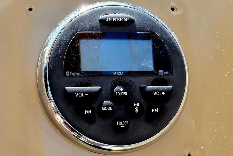 Slide: The Image of Jensen audio system in 2019 Starcraft EX 20 C, featuring Bluetooth and volume controls. - 26
