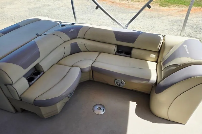 Slide: The Image of Luxurious seating area on a 2019 Starcraft EX 20 C boat with cup holders and speaker. - 37