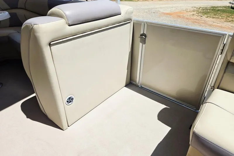 Slide: The Image of 2019 Starcraft EX 20 C boat interior with beige seating and open gate. - 7