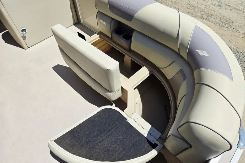 Slide: The Image of 2019 Starcraft EX 20 C boat interior with beige seating and storage compartment. - 8