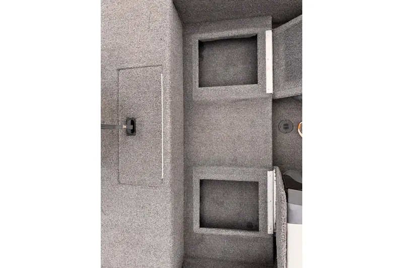 Slide: The Image of Interior view of a 2019 Lowe Skorpion 16 boat, showcasing carpeted storage compartments. - 11