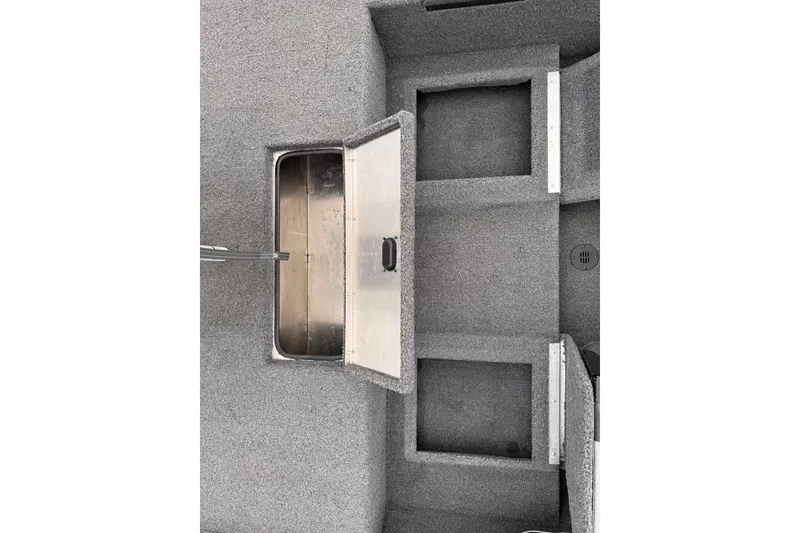 Slide: The Image of 2019 Lowe Skorpion 16 boat interior with open storage compartments and gray carpeting. - 13