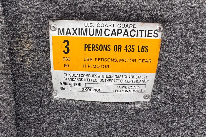 Slide: The Image of U.S. Coast Guard capacity label for 2019 Lowe Skorpion 16, 3 persons or 435 lbs. - 14