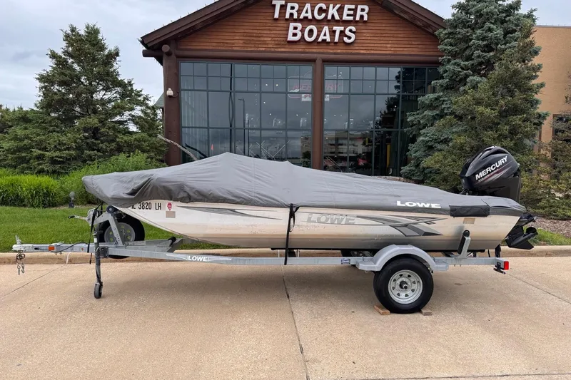 Slide: The Image of 2019 Lowe Skorpion 16 boat with cover on trailer outside Tracker Boats store. - 20