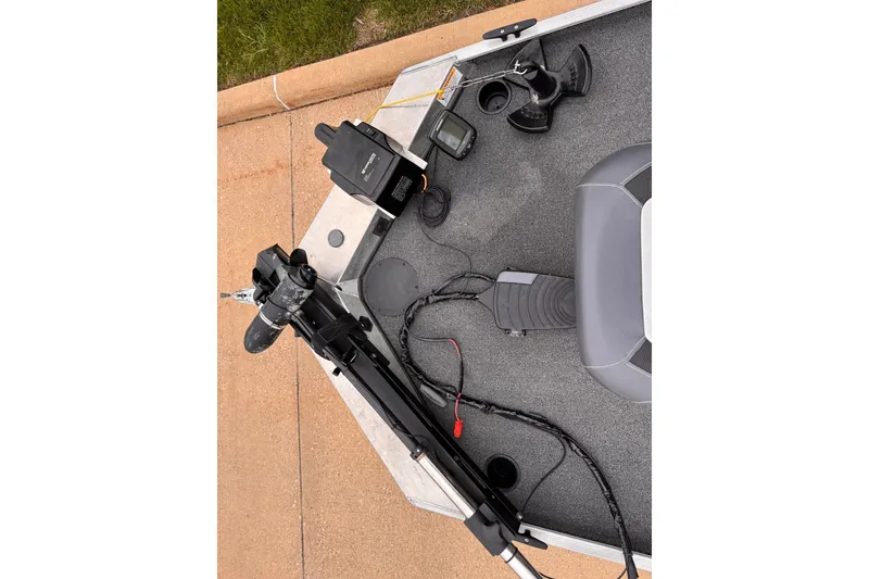 Slide: The Image of 2019 Lowe Skorpion 16 boat deck with trolling motor and fishing equipment. - 3