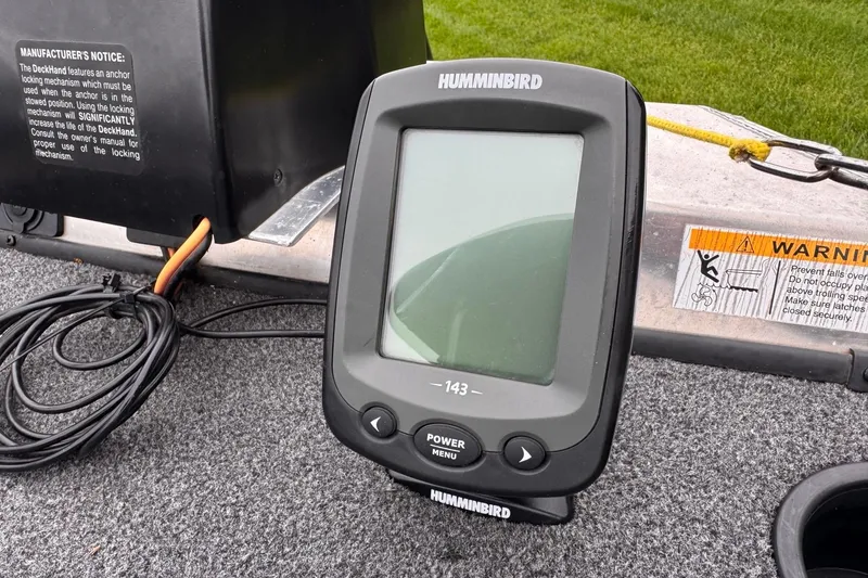 Slide: The Image of Fishfinder on 2019 Lowe Skorpion 16 boat deck, featuring Humminbird display and warning label. - 5