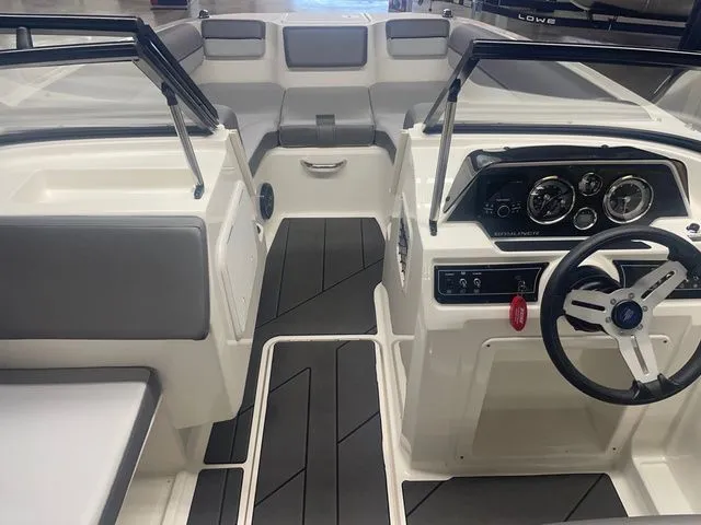 Slide: The Image of Interior of 2023 Bayliner DX 2000 boat with modern dashboard. - 3