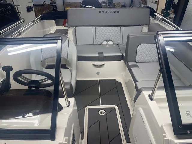 Slide: The Image of Interior of 2023 Bayliner DX 2000 boat with gray upholstery. - 4